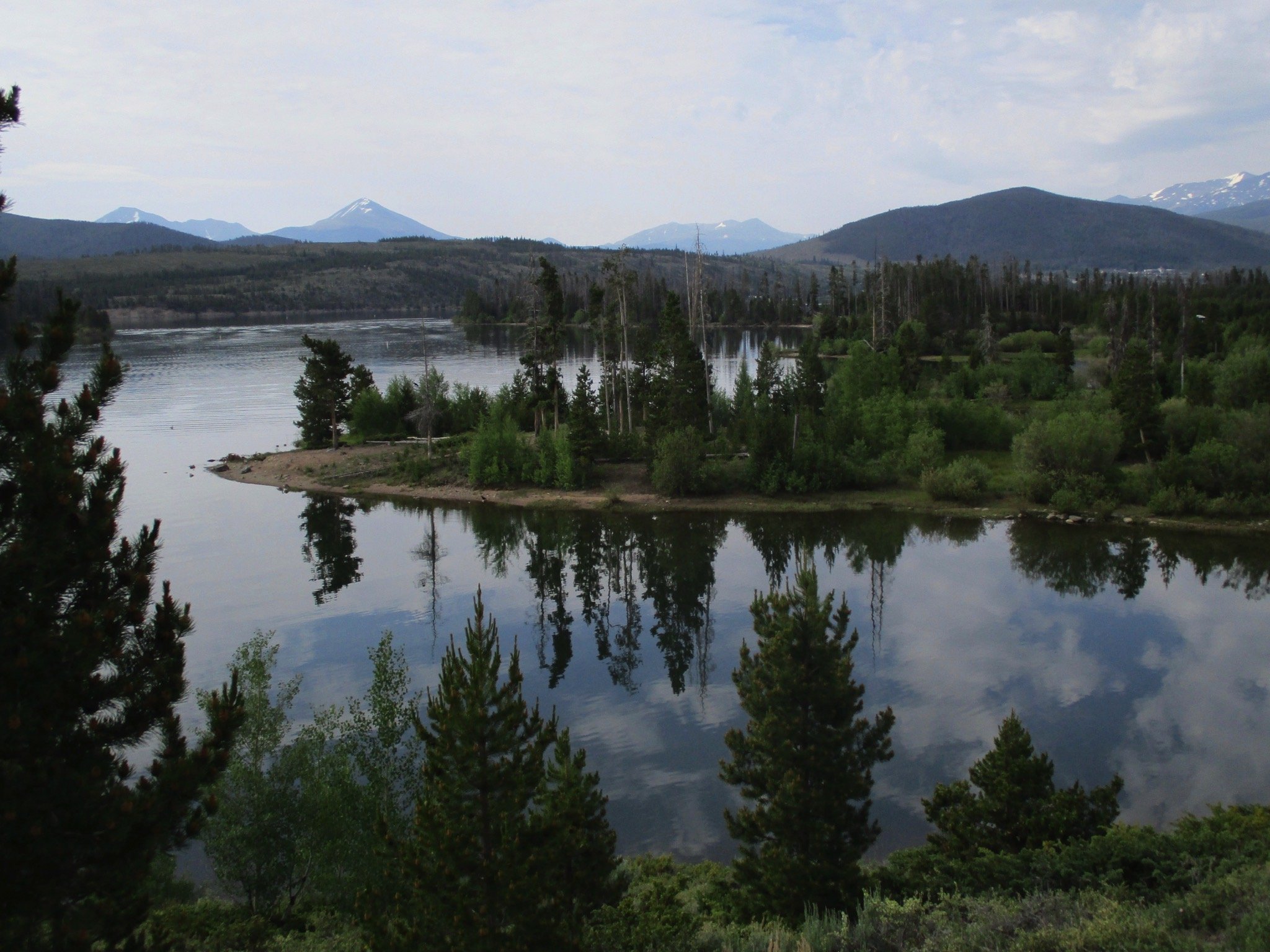 Dillion Reservoir--There mountains in the background, and island with conifers and shrubs